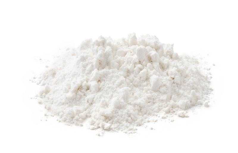 Pile of wheat flour isolated on white background